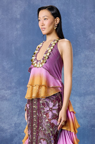 Three-quarter view of the ombre ruffled halter and embellished skirt at Mrs. G