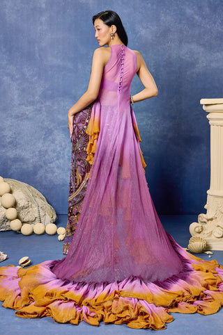 Back view of the aubergine skirt set with a graduated ruffle train at Mrs. G