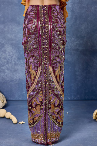 Close-up of the embroidered aubergine skirt at Mrs. G