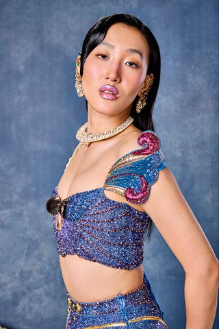 Close-up of the off-shoulder corset with a winged shoulder piece at Mrs. G