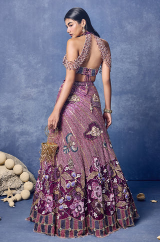 Back view of the pink lehenga set with the halter blouse and floral hem at Mrs. G