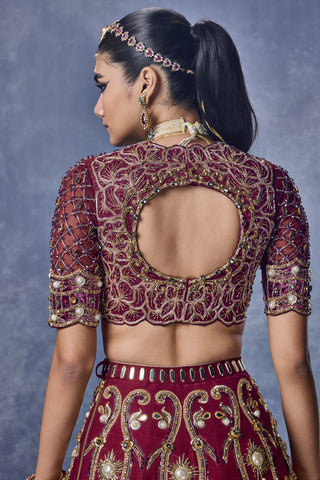 Back view of the maroon blouse with a keyhole back and the embroidered lehenga at Mrs. G
