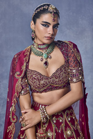Zoomed-in maroon blouse with antique-gold detailing and sheer sleeves at Mrs. G