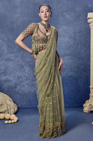 Front view of the sage green secret desire saree set with a peplum blouse at Mrs. G