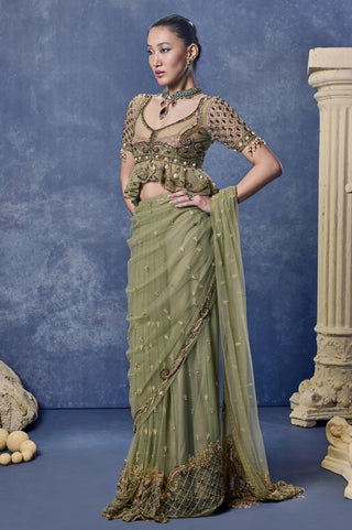 Front view of the sage green tulle saree draped over the shoulder at Mrs. G