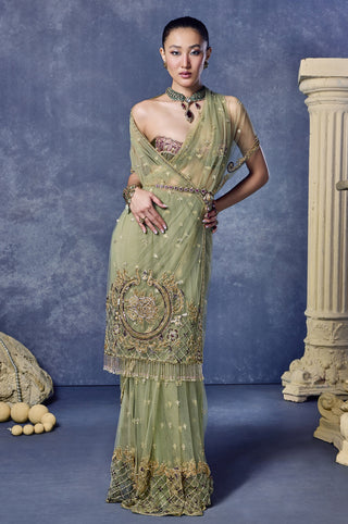 Side view of the sage green saree with an embroidered pallu border at Mrs. G
