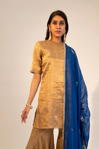 Closer front view of the gold zari tissue kurti & garara paired with electric blue dupatta by Sheela Suthar at Mrs. G