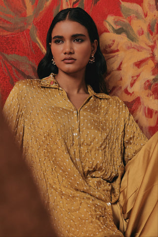 Waist-up seated view of the tunic with bandhani dots, yellow ziya a-line hi-low co-ord set by Twenty Nine at Mrs. G