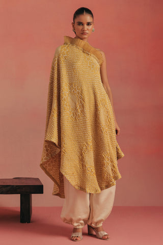 Front view of the one-shoulder dress with a hand on the hip, yellow ziya one-shoulder kurta set by Twenty Nine at Mrs. G