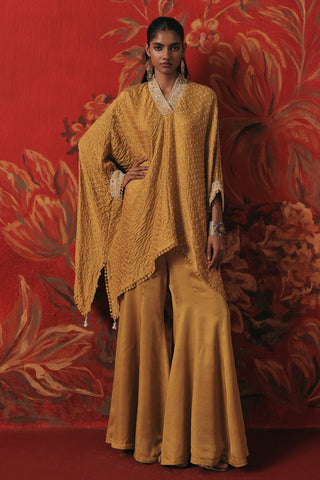 Full-length front view of the loose bandhani kaftan and bootcut pants, yellow ziya tassel kaftan set by Twenty Nine at Mrs. G