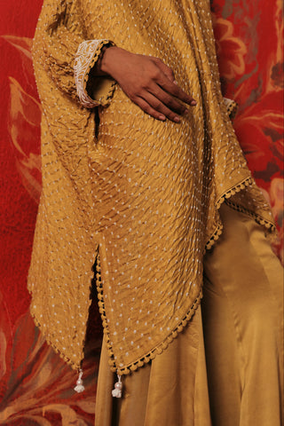 Close-up of the tassel hem and bandhani dots on the kaftan, yellow ziya tassel kaftan set by Twenty Nine at Mrs. G