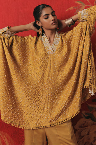 Front view of the kaftan with the sleeves held out, yellow ziya tassel kaftan set by Twenty Nine at Mrs. G
