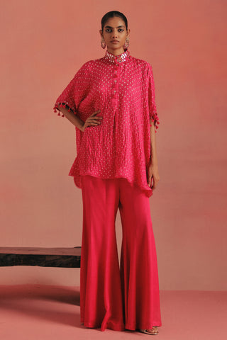 Full-length front view of the oversize bandhani shirt and flared pants, bubblegum pink ziya mirrorwork co-ord set by Twenty Nine at Mrs. G