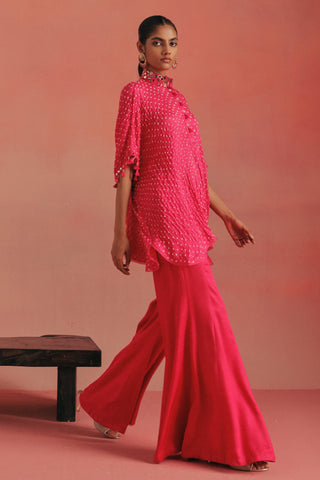 Walking view of the shirt and flared bootcut pants, bubblegum pink ziya mirrorwork co-ord set by Twenty Nine at Mrs. G