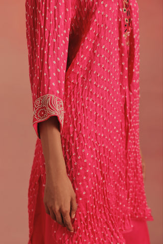 Close-up of the embroidered cuff and bandhani dots on the sleeve, bubblegum pink ziya mirrorwork hi-low kurta set by Twenty Nine at Mrs. G