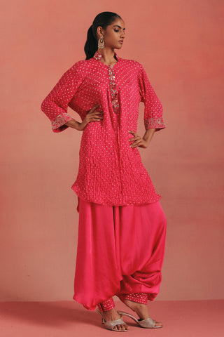 Front view with a hand on the hip and the kurta open at the front, bubblegum pink ziya mirrorwork hi-low kurta set by Twenty Nine at Mrs. G