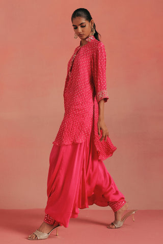Side view of the hi-low kurta and gathered dhoti, bubblegum pink ziya mirrorwork hi-low kurta set by Twenty Nine at Mrs. G