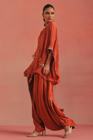 Three-quarter walking view of the cape top and gathered dhoti, burnt orange ziya cape top with dhoti by Twenty Nine at Mrs. G