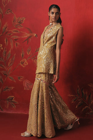 Full-length walking view of the jacket and flared sharara, citrus yellow ziya peplum sharara set by Twenty Nine at Mrs. G