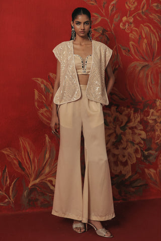 Full-length front view of the ivory gilet over the bandeau and bellbottoms, ivory ziya jacket set by Twenty Nine at Mrs. G