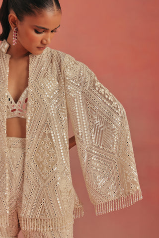 Close-up of the cape sleeve with mirror work and a tassel fringe, ivory ziya mirrorwork sharara set by Twenty Nine at Mrs. G