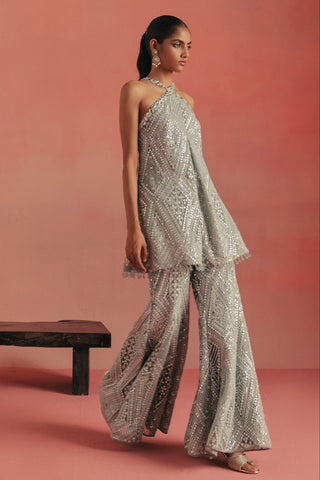 Walking view of the tunic and bootcut pants in motion, blue ziya cross strap sharara set by Twenty Nine at Mrs. G