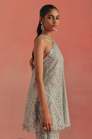 Side profile of the halter tunic with a mirror work hem, blue ziya cross strap sharara set by Twenty Nine at Mrs. G