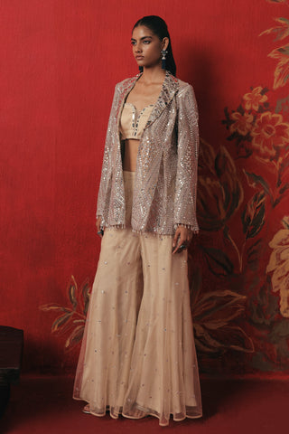 Full-length view of the blazer and bootcut pants beside a dark bench, silver ziya blazer sharara set by Twenty Nine at Mrs. G