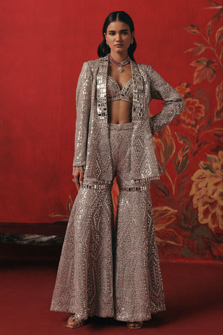 Full-length front view with one hand on the hip, pearl silver ziya jacket sharara set by Twenty Nine at Mrs. G