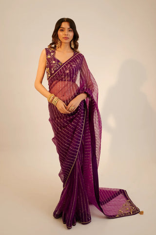 Purple embroidered organza saree paired with blouse