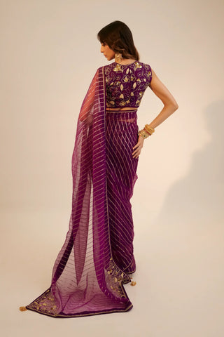 Purple embroidered organza saree paired with blouse
