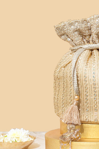 Gold yari embroidered base potli