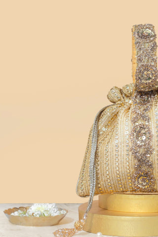 Gold yari embroidered potli