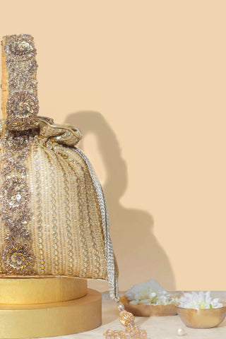 Gold yari embroidered potli