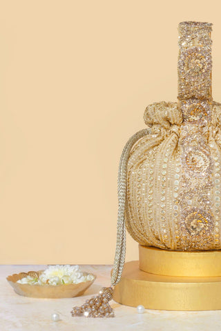 Gold yari embroidered round potli