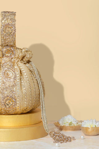 Gold yari embroidered round potli