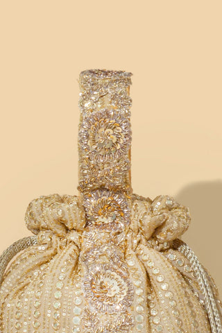 Gold yari embroidered round potli